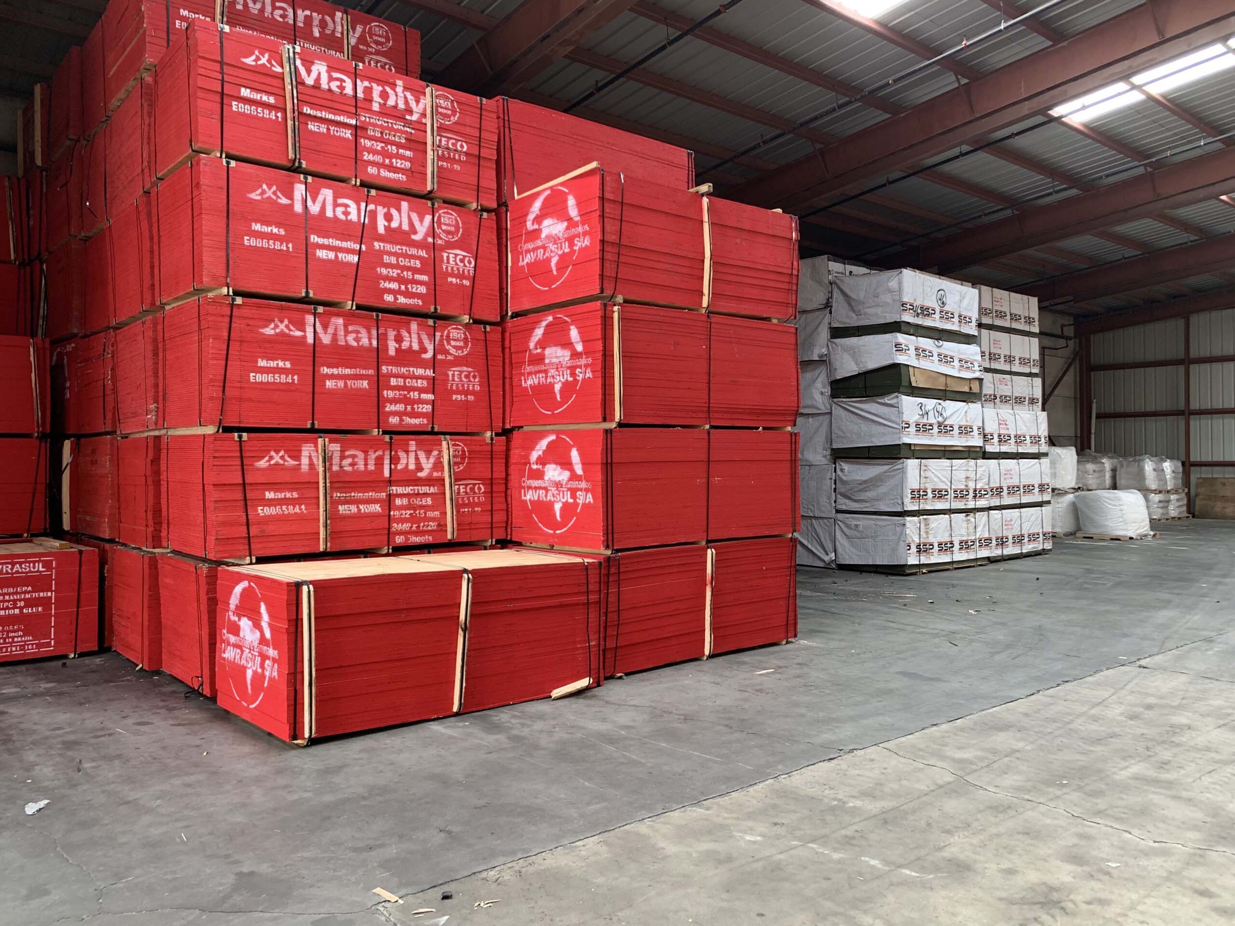 Concrete forming materials being delivered to a construction supply yard